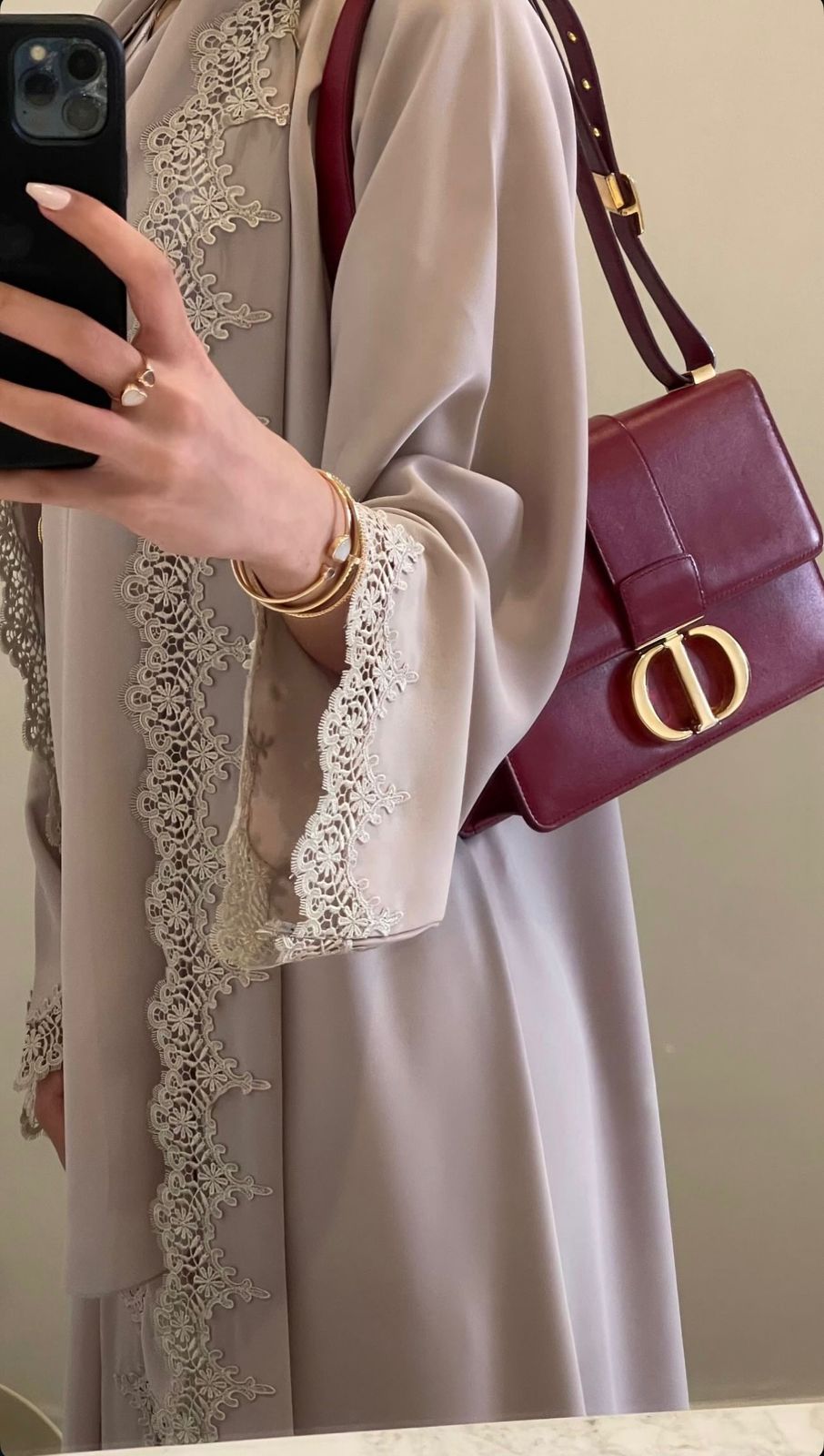 An elegant lace abaya crafted with soft