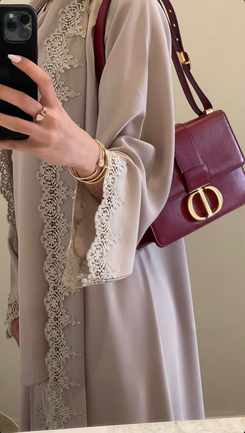 An elegant lace abaya crafted with soft